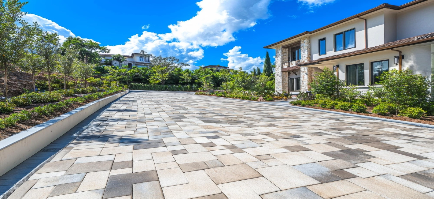 Interlocking paver driveway and outdoor hardscape design by Patios Dallas